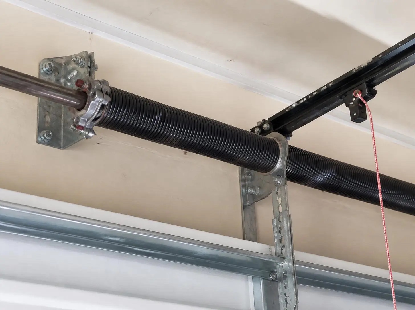 Garage door torsion spring and hardware
